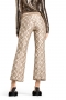Cambio Faith golden lurex chain in car 